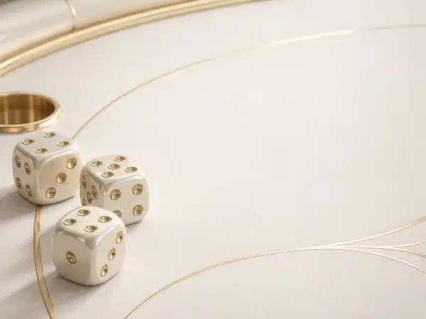 Decorative ivory dice on a cream and gold table